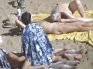 Kinky couple doesn't feel shy while making love on a nude beach