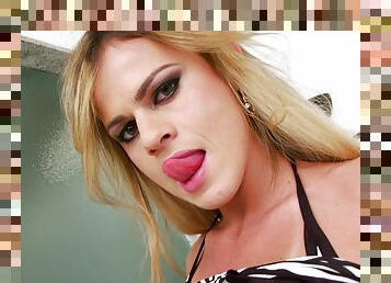 Big-assed blond tranny Victoria Coelho plays with her schlong indoors