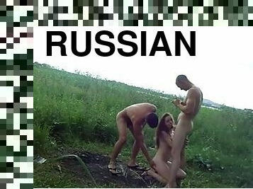 Brown-haired Russian bitch gets double teamed in a field