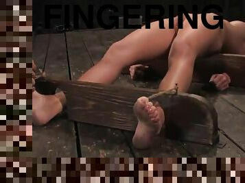 Krissy Lynn gets her vag fingered and toyed while being in a pillory