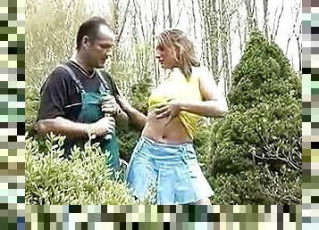 Young blonde boned outdoors by gardener