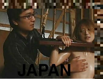 Japanese AV Model bound using rope and wood in this video