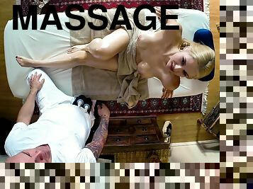 Cuddly blonde babe with big tits gets oiled up then fucked hardcore on a massage table