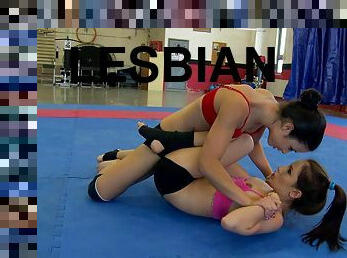 Two sporty lesbians fight on tatami and lick each other's vags