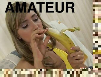 A food obsessed babe peels then fucks a banana before eating it