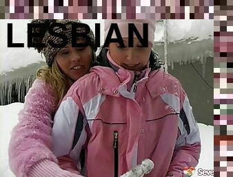 Lesbian chicks warming up by having sex outdoors in the snow