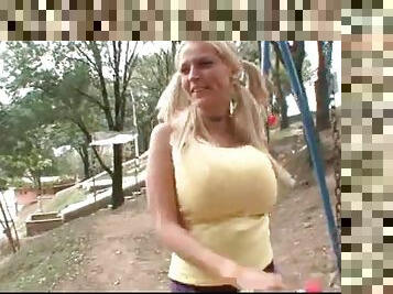 Pigtails and big tits on cute blonde outdoors