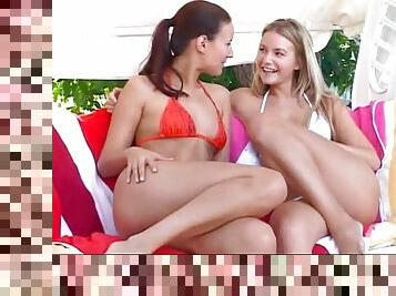 Two hotties in bikinis are getting their clits buzzing