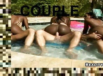 Three interracial couples have some naughty banging on the poolside