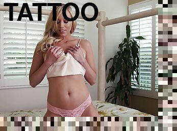 Sexy Brea Bennett finger fucks her shaved pussy in a bedroom