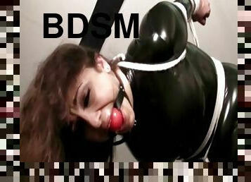 Jewell Marceau enjoys being gagged and bound in latex in BDSM fetish play