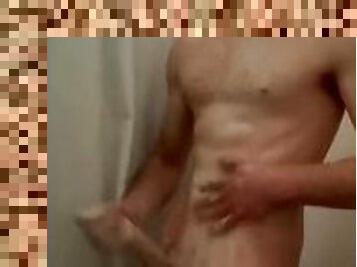 Hunky teen getting lathered up and blowing a load in the shower