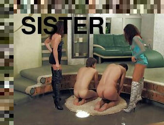 Pair of naughty sisters having fun with their submissive slaves