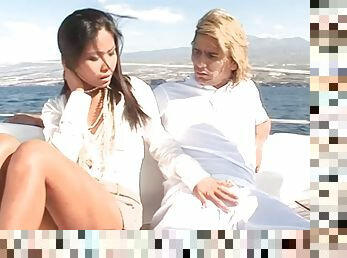 Stunning Asian lady is having a threesome on the luxurious boat