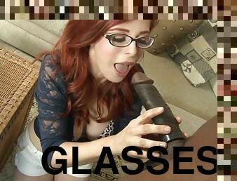 Redhead babe in glasses gets banged by Black guy