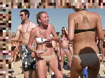 Babes at the beach party showing off ass and tits in bikini