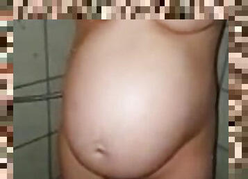 Pregnant pretty girl takes a shower and masturbates