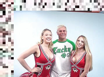 Two attractive cheerleaders going crazy over their friend's dick