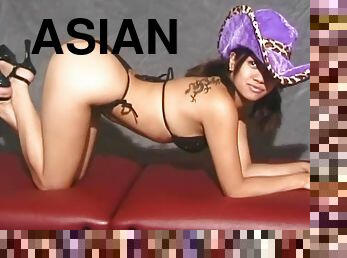 Seductive Asian chick in a cowboy hat shows off her delicious body