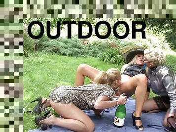 Champagne bottle fucking with a trio of gorgeous ladies outdoors