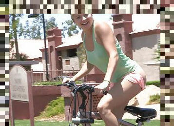 Mindy rides a bike to the park where she teases her pussy