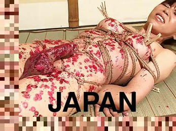 Bound Japanese tranny covered in hot wax and loving it