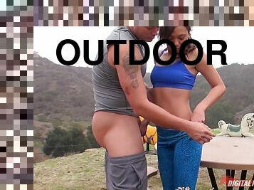 Fitness babe with a sexy ass in workout pants fucks outdoors