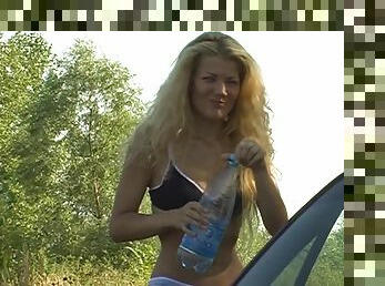 Blonde plays lakeside with her sexy small tits exposed