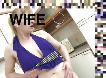 Shaved housewife pussy pleasured by dildos in the kitchen