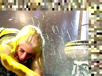 Sexy blonde masturbates while water pours down on her