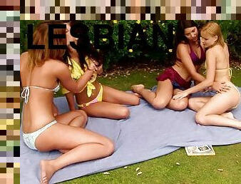 Four slutty lesbians fuck in the backyard after playing cards