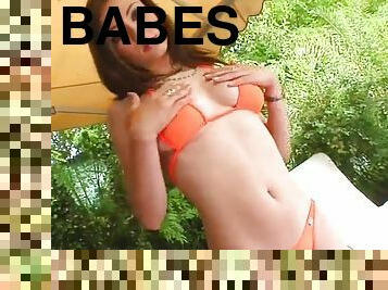 A sizzling babe in a bikini has threesome sex in a backyard