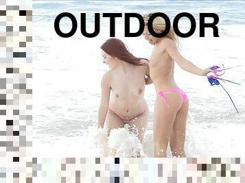 BLond and redhead models are going naughty in the beach