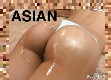 Some oiled up passion with a naughty Asian doll