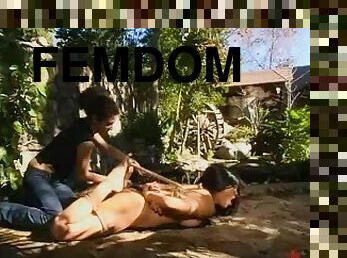 Mika Tan gets her cunt stuffed with a wired dildo in the garden