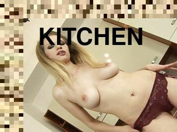 Blonde babe enjoys sucking and riding a cock in the kitchen