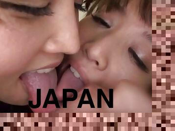 Two nasty Japanese girls lick a cock and ride it by turns