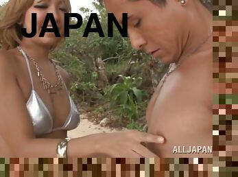 Juicy Japanese babe is getting balled on the beach