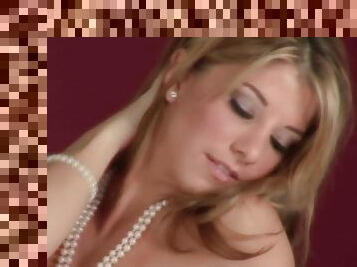 Pretty Amber Elise poses for the cam in a pearl necklace