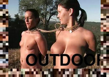 Two brunettes get tormented and fucked by two men outdoors