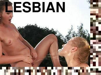 Kinky lesbians Chary and Hadjara pee on each other in the yard