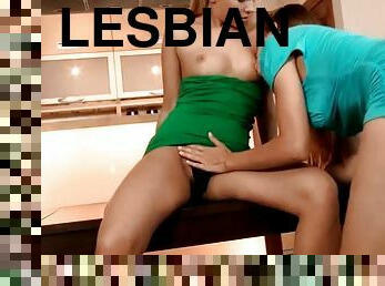 Sexy lesbian duo making out on the kitchen table