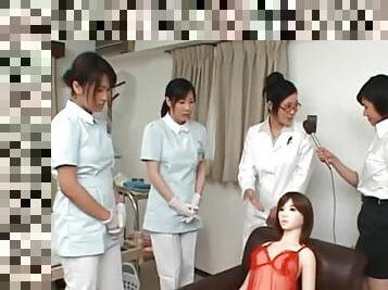Asian nurse giving handjob slurps jizz out of cock
