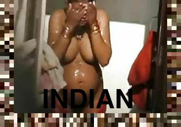 Pregnant Indian chick with big boobs takes a shower