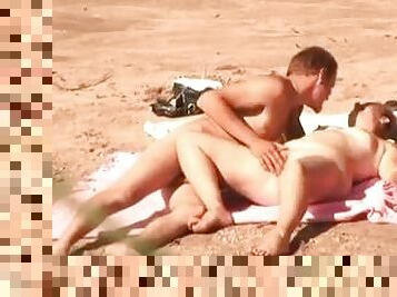 Insatiable wife gets fucked in missionary position on a beach