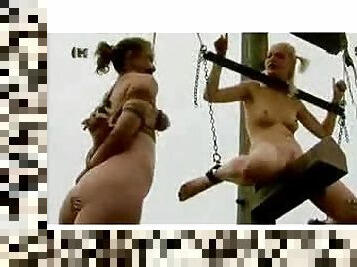 One babe is hanged on her tits and two others on their necks