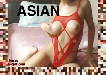 Big tits asian masturbates on the bed