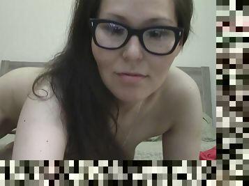 Nerdy woman masturbates in front of the webcam