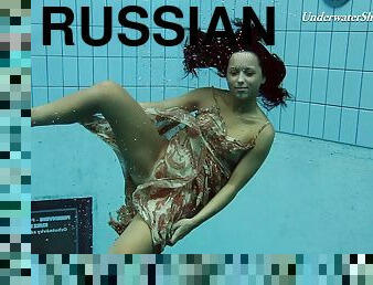 Russian brunette teen shading attire in the pool lovely