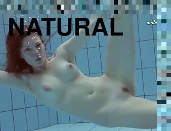 Superb shoot of natural tits redhead dame swimming in pool